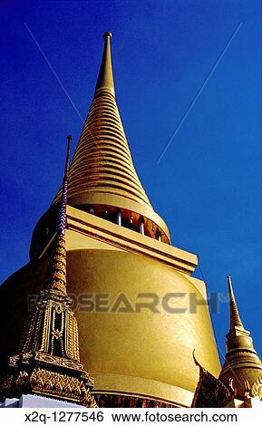 A golden spire, at the Temple of the Emerald Buddha, Bangkok Thailand View Large Photo Image Stock Photograph - A golden spire, at the Temple of the Emerald Buddha, Bangkok Thailand. Fotosearch