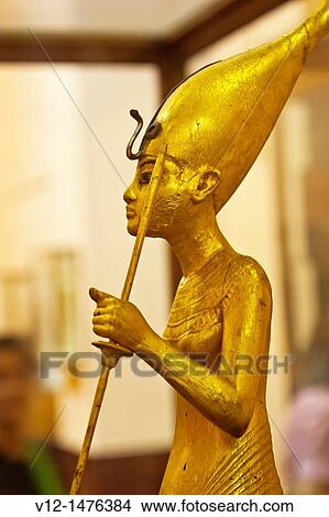 A Golden Statue of king Tutankhamen, The King as Harpooner, New Kingdom, Egyptian museum, Cairo, Egypt View Large Photo Image Picture - A Golden Statue of king Tutankhamen, The King as Harpooner, New Kingdom, Egyptian museum, Cairo, Egypt. Fotosearch