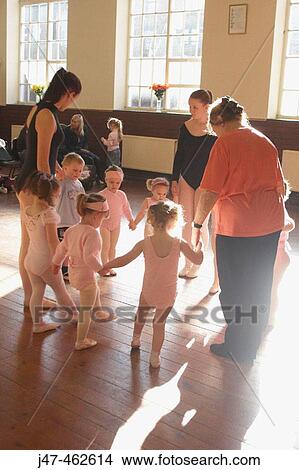 A group of 3 year old children in ballet class, dressed in pink leotards and tights View Large Photo Image Picture - A group of 3 year old children in ballet class, dressed in pink leotards and tights. Fotosearch