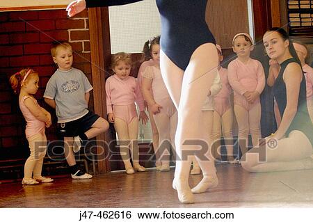 A group of 3 year old children in ballet class, dressed in pink leotards and tights, watching the teacher demonstrate View Large Photo Image Stock Photograph - A group of 3 year old children in ballet class, dressed in pink leotards and tights, watching the teacher demonstrate. Fotosearch