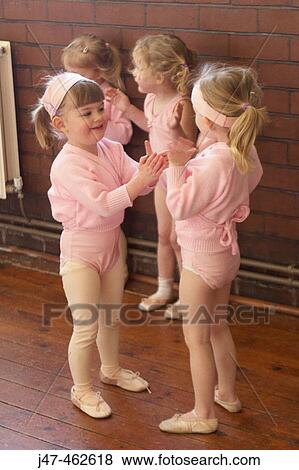 A group of 3 year old girls in ballet class, dressed in pink leotards and tights, clapping. View Large Photo Image Stock Photo - A group of 3 year old girls in ballet class, dressed in pink leotards and tights, clapping.. Fotosearch