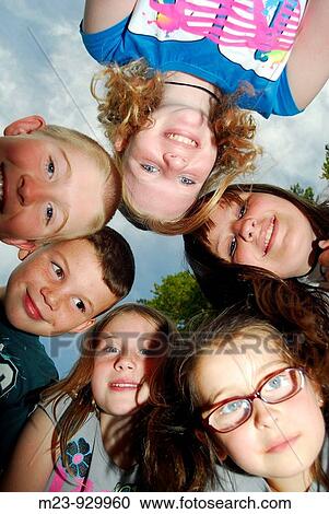 A group of children gather over a camera for a portrait, Pennsylvania, USA View Large Photo Image Stock Image - A group of children gather over a camera for a portrait, Pennsylvania, USA. Fotosearch