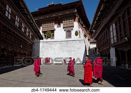 A group of monks in the patio of Trongsa Dzong, Trongsa, Bhutan, Asia. View Large Photo Image Picture - A group of monks in the patio of Trongsa Dzong, Trongsa, Bhutan, Asia.. Fotosearch