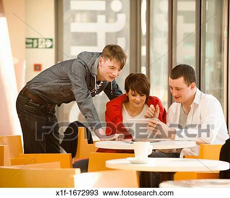 A group of young people - two boys and one girl - talking chatting in a cafe, UK View Large Photo Image Stock Image - A group of young people - two boys and one girl - talking chatting in a cafe, UK. Fotosearch