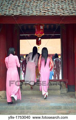 A group of young women dressed in traditional Ao Dai dresses posing for photos at The Temple of Literature View Large Photo Image Stock Image - A group of young women dressed in traditional Ao Dai dresses posing for photos at The Temple of Literature. Fotosearch