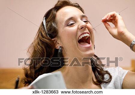 A happy woman laughing View Large Photo Image Stock Image - A happy woman laughing. Fotosearch