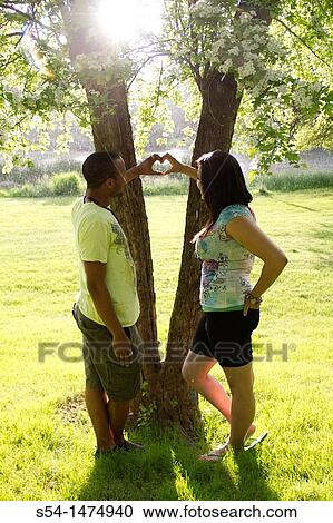 A happy, young, african-american couple outdoors View Large Photo Image Stock Image - A happy, young, african-american couple outdoors. Fotosearch