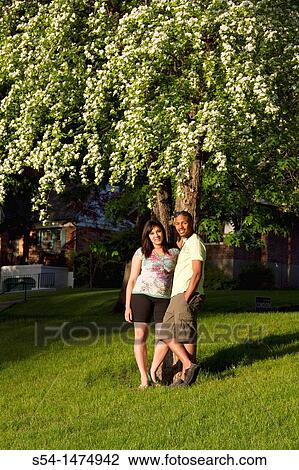 A happy, young, african-american couple outdoors View Large Photo Image Stock Image - A happy, young, african-american couple outdoors. Fotosearch