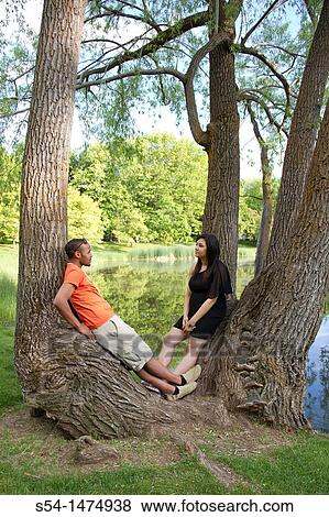 A happy, young, african-american couple outdoors View Large Photo Image Stock Photo - A happy, young, african-american couple outdoors. Fotosearch