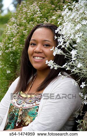 A happy, young, african-american female outdoors View Large Photo Image Stock Photo - A happy, young, african-american female outdoors. Fotosearch