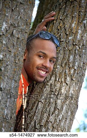 A happy, young, african-american male outdoors View Large Photo Image Stock Photo - A happy, young, african-american male outdoors. Fotosearch