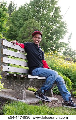 A happy, young, african-american male outdoors View Large Photo Image Stock Photograph - A happy, young, african-american male outdoors. Fotosearch
