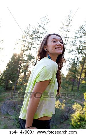 A happy young caucasian woman outdoors View Large Photo Image Stock Photo - A happy young caucasian woman outdoors. Fotosearch