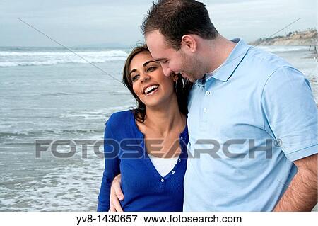 A happy young couple at the beach, California View Large Photo Image Stock Photo - A happy young couple at the beach, California. Fotosearch