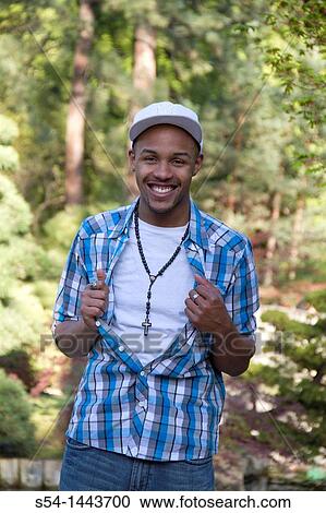 A happy young man outdoors. View Large Photo Image Stock Image - A happy young man outdoors.. Fotosearch