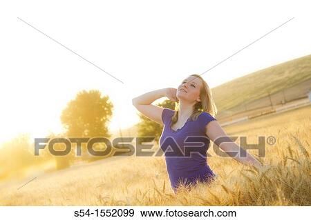 A happy young woman at a farm in Lewiston, Idaho, USA View Large Photo Image Stock Photo - A happy young woman at a farm in Lewiston, Idaho, USA. Fotosearch