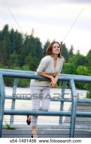 Stock Photograph - A happy young woman in Spokane, Washington, USA. Fotosearch