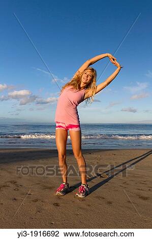 A healthy, fit woman exercises at the beach at Wailea, Maui, Hawaii View Large Photo Image Stock Image - A healthy, fit woman exercises at the beach at Wailea, Maui, Hawaii. Fotosearch