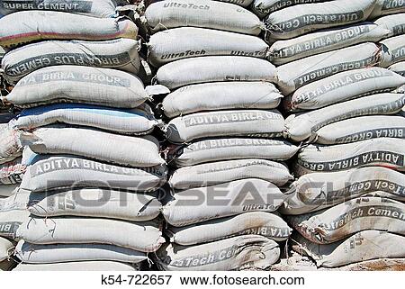 A heap of cement bags, lying on a road side near Mhatre bridge, Pune, Maharashtra, India. View Large Photo Image Stock Photo - A heap of cement bags, lying on a road side near Mhatre bridge, Pune, Maharashtra, India.. Fotosearch