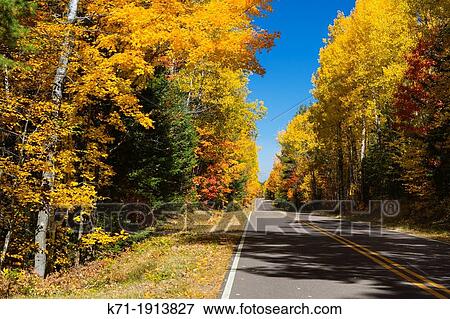 A highway with brilliant fall foliage color near Minocqua, Wisconsin, USA View Large Photo Image Stock Photo - A highway with brilliant fall foliage color near Minocqua, Wisconsin, USA. Fotosearch