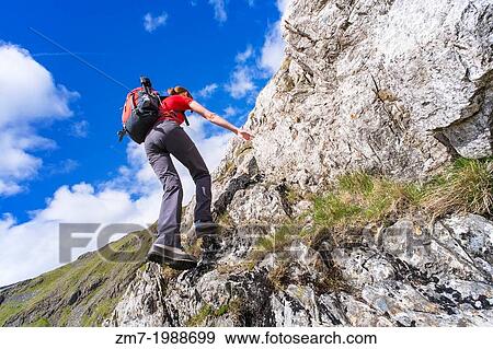 A hiker climbing Cam Crag Ridge in the Langstrath valley leading to the summit of Glaramara in the Lake District, Cumbria. View Large Photo Image Stock Photo - A hiker climbing Cam Crag Ridge in the Langstrath valley leading to the summit of Glaramara in the Lake District, Cumbria.. Fotosearch