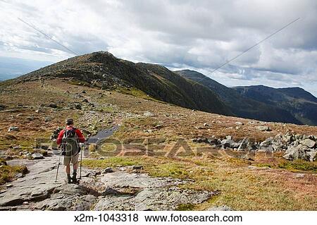 A hiker on the Appalachian Trail descending Mount Washington Located in the White Mountains, New Hampshire USA Notes: Mount Washington is famous for the highest wind gust ever measured on earth at 231 miles per hour on April 12, 1934 View Large Photo Image Stock Photo - A hiker on the Appalachian Trail descending Mount Washington Located in the White Mountains, New Hampshire USA Notes: Mount Washington is famous for the highest wind gust ever measured on earth at 231 miles per hour on April 12, 1934. Fotosearch