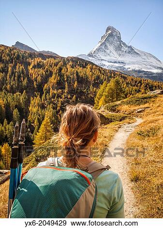 Stock Photo - A hiker preparing to hike up the Matterhorn near Zermatt, Switzerland.. Fotosearch