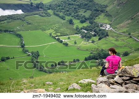 A hiker stops for lunch high up above Hartsop and Brothers Water in the Lake District. View Large Photo Image Stock Image - A hiker stops for lunch high up above Hartsop and Brothers Water in the Lake District.. Fotosearch