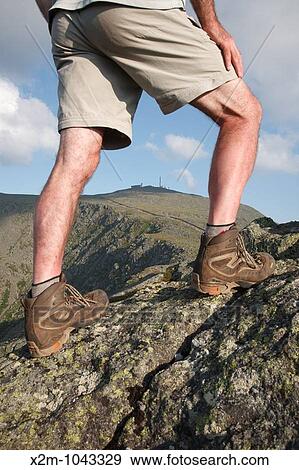A hiker stretching leg on Mount Clay with Mount Washington in the background Located in the White Mountains, New Hampshire USA Notes: Mount Washington is famous for the highest wind gust ever measured on earth at 231 miles per hour on April 12, 1934 View Large Photo Image Stock Photo - A hiker stretching leg on Mount Clay with Mount Washington in the background Located in the White Mountains, New Hampshire USA Notes: Mount Washington is famous for the highest wind gust ever measured on earth at 231 miles per hour on April 12, 1934. Fotosearch