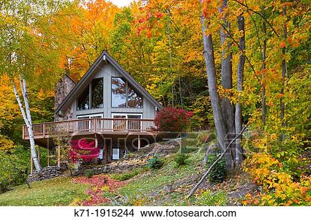 A hillside chalet with fall foliage color in Munising, Michigan, USA View Large Photo Image Picture - A hillside chalet with fall foliage color in Munising, Michigan, USA. Fotosearch