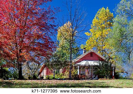 Stock Photography - A home in rural Ozarks, Missouri with fall foliage color. Fotosearch