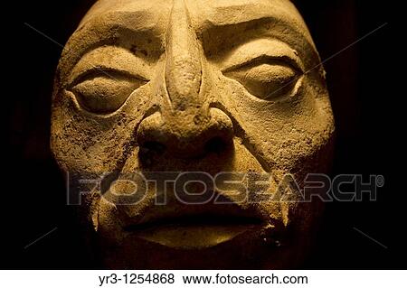 Stock Photo - A human head sculpture sits on display in the museum at the ancient Mayan city of Palenque, Chiapas, Mexico.. Fotosearch