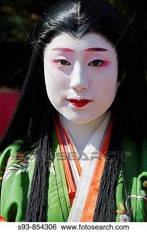 Stock Photograph - A Japanese woman dressed up as a lady of the Heian period for the Jidai Matsuri Festival of Ages in Kyoto. Fotosearch
