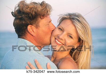 A kiss on the cheek View Large Photo Image Stock Photo - A kiss on the cheek. Fotosearch