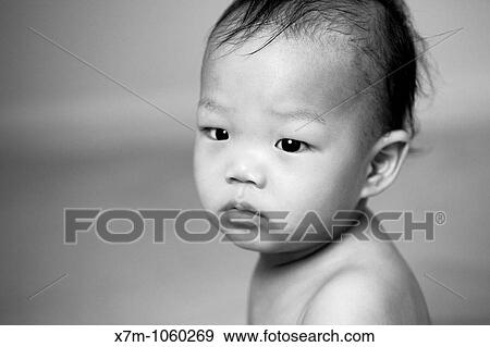 A Korean baby boy gets his bearings after a bath View Large Photo Image Stock Photo - A Korean baby boy gets his bearings after a bath. Fotosearch