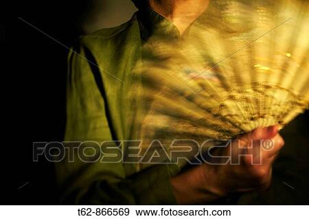 A lady with fan Movement View Large Photo Image Stock Photo - A lady with fan Movement. Fotosearch