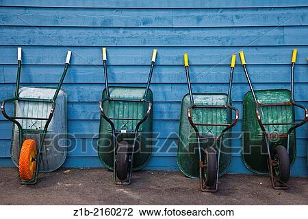 A line of wheelbarrows for boat owners to use for carrying provisions along the dock of a marina. View Large Photo Image Stock Image - A line of wheelbarrows for boat owners to use for carrying provisions along the dock of a marina.. Fotosearch