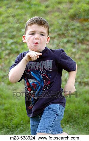 A little boy points as he dances View Large Photo Image Picture - A little boy points as he dances. Fotosearch
