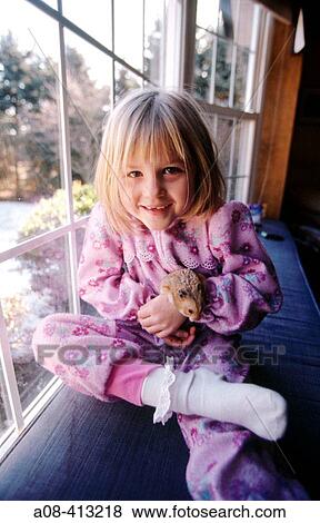 A little girl and her pet hamster. Pennsylvania. USA. View Large Photo Image Stock Photo - A little girl and her pet hamster. Pennsylvania. USA.. Fotosearch