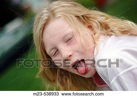 A little girl comments on a situation by sticking out her tongue View Large Photo Image Stock Image - A little girl comments on a situation by sticking out her tongue. Fotosearch