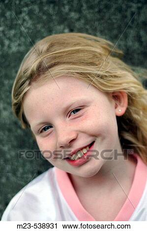 A little girl gives a cute smile View Large Photo Image Stock Image - A little girl gives a cute smile. Fotosearch