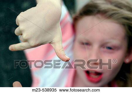 A little girl gives the thumbs-Downign View Large Photo Image Stock Photography - A little girl gives the thumbs-Downign. Fotosearch