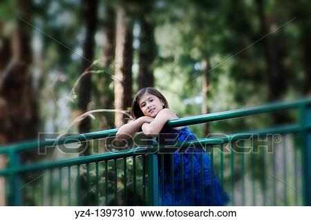 A little girl outdoors at the park View Large Photo Image Stock Image - A little girl outdoors at the park. Fotosearch
