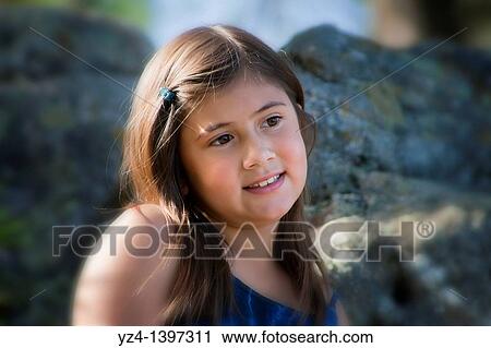A little girl outdoors at the park View Large Photo Image Stock Image - A little girl outdoors at the park. Fotosearch