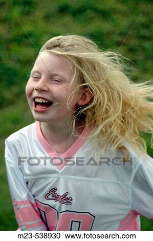 A little girl runs across the lawn laughing View Large Photo Image Stock Image - A little girl runs across the lawn laughing. Fotosearch