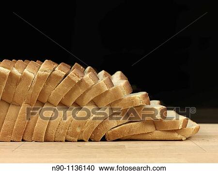 A loaf of freshly baked white bread View Large Photo Image Stock Image - A loaf of freshly baked white bread. Fotosearch