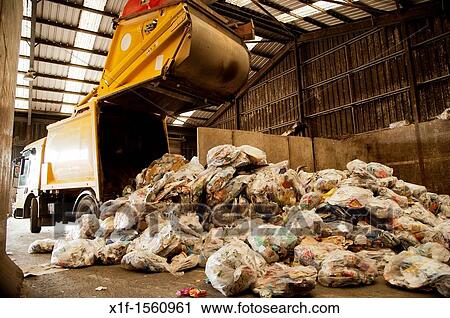 A local authority truck dumping plastic sacks of dry recycling waste at a management centre UK View Large Photo Image Stock Image - A local authority truck dumping plastic sacks of dry recycling waste at a management centre UK. Fotosearch