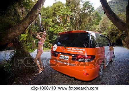 Stock Image - A local hotel, hostel, campground is found in pristine settings in Franz Josef. This is called the Rain Forest Retreat.. Fotosearch