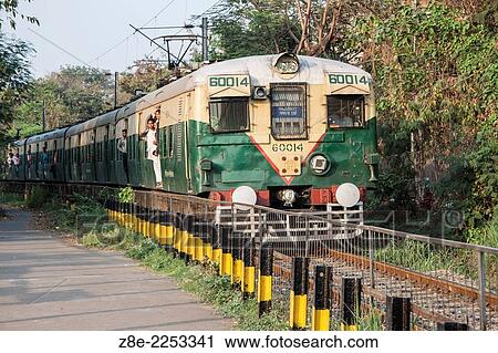 A local train passing by the Millennium park in Kolkata (Calcutta), West Bengal, India. View Large Photo Image Stock Image - A local train passing by the Millennium park in Kolkata (Calcutta), West Bengal, India.. Fotosearch