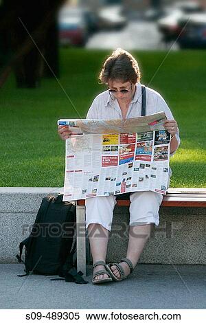 A lost tourist consults her map at Schwarzenberg Platz, in Vienna, Austria. View Large Photo Image Stock Photography - A lost tourist consults her map at Schwarzenberg Platz, in Vienna, Austria.. Fotosearch